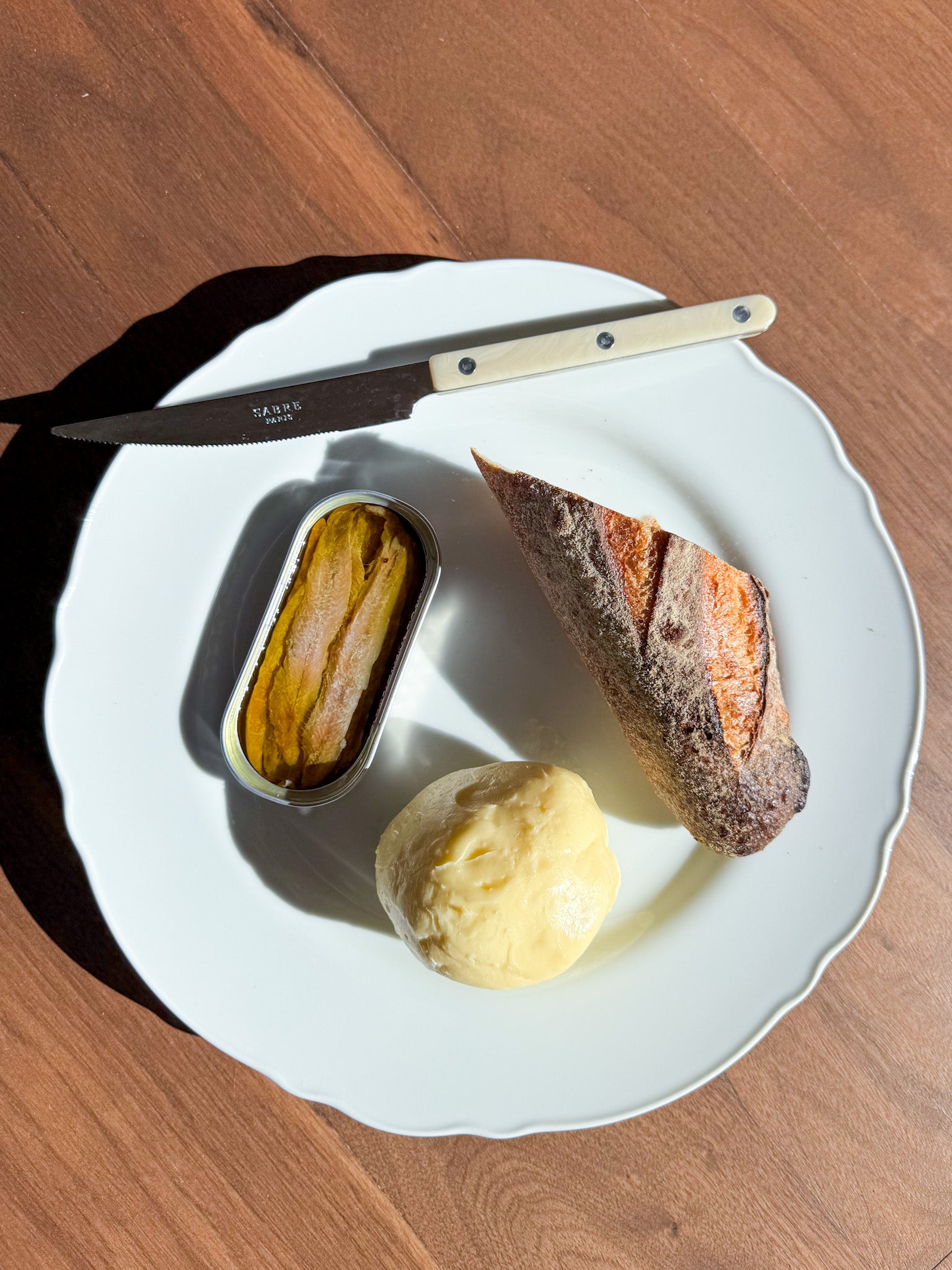 Simple meal of anchovies, butter amd bread
