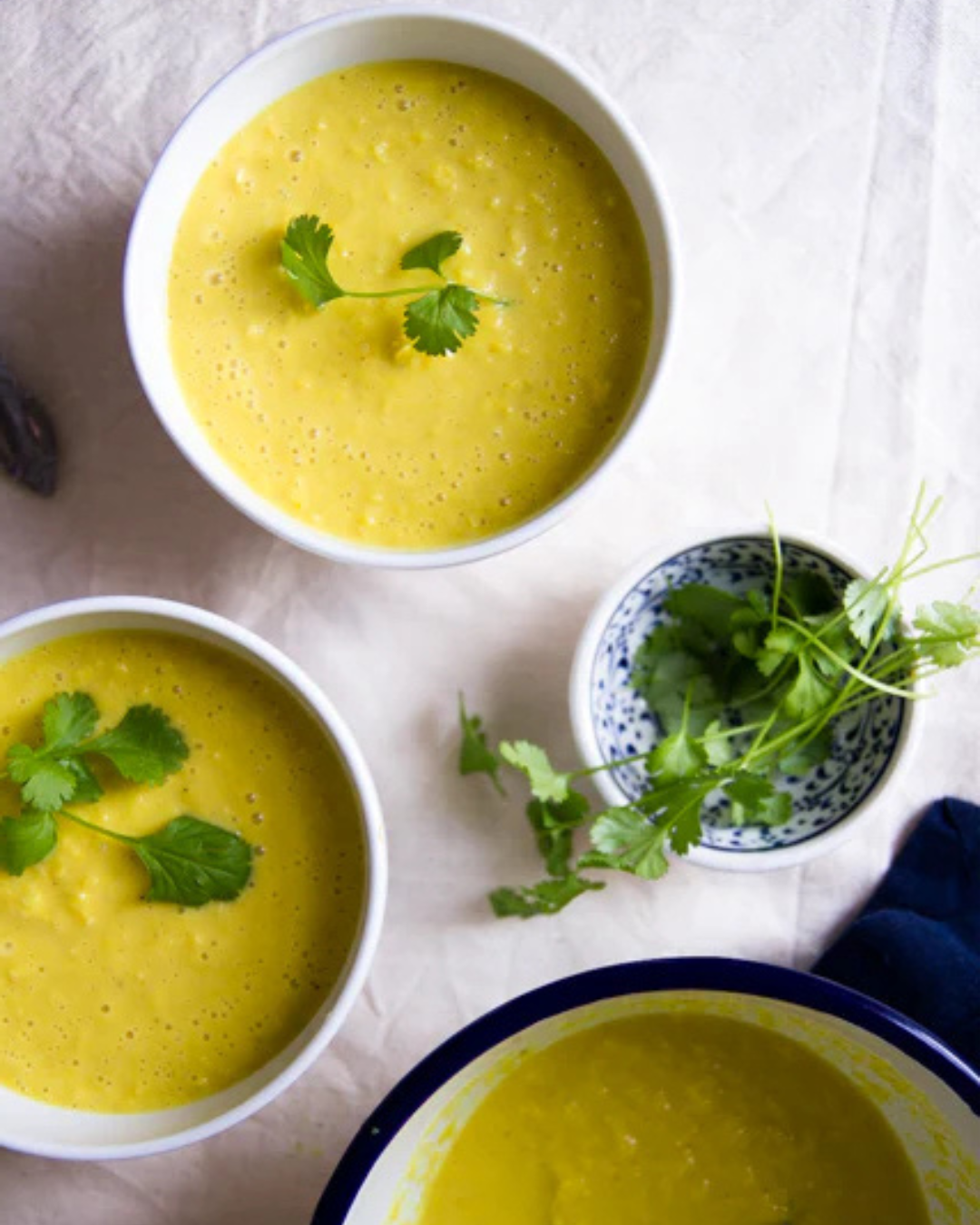 Three bowls of crab and corn soup