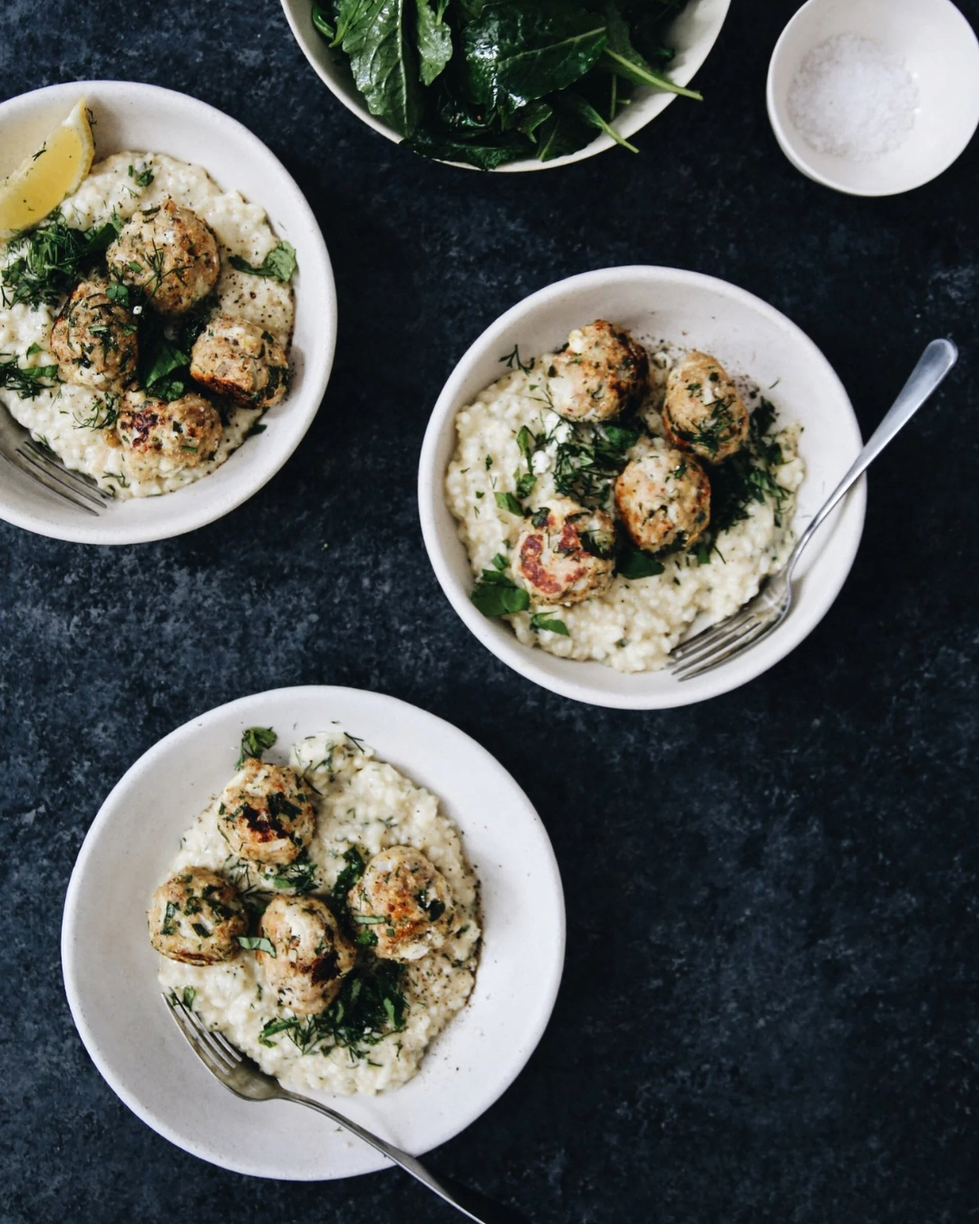 Three bowls of risotto and meatballs